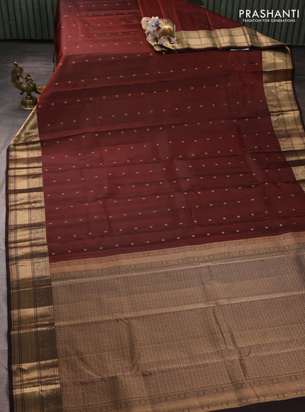 Pure kanchipuram silk saree rust shade and coffee brown with allover zari woven buttas and zari woven korvai border
