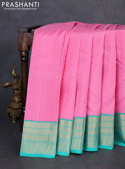 Pure kanchipuram silk saree light pink and teal green with allover zari woven buttas and zari woven korvai border