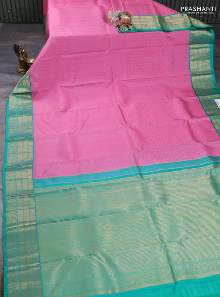 Pure kanchipuram silk saree light pink and teal green with allover zari woven buttas and zari woven korvai border