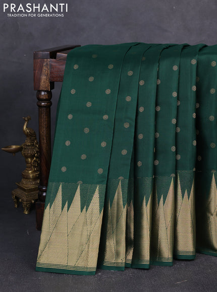 Pure kanchipuram silk saree bottle green with allover zari woven buttas and temple zari woven border