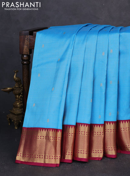 Pure kanchipuram silk saree teal blue and wine shade with allover small zari checks & buttas and zari woven border