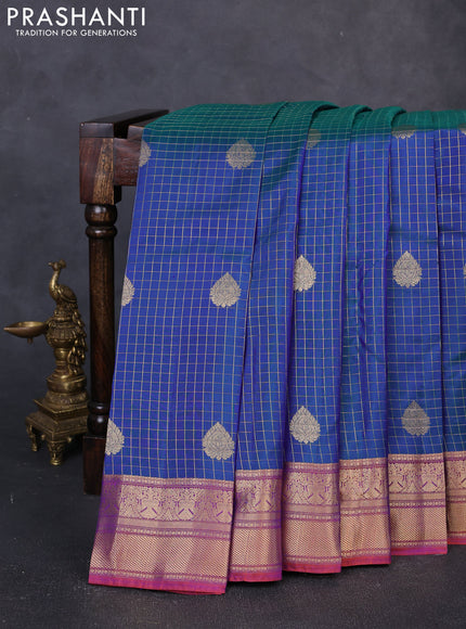 Pure kanchipuram silk saree dual shade of bluish green and orange shade with allover zari checks & buttas and zari woven border
