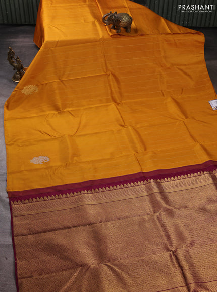 Pure kanchipuram silk saree dark mustard and purple with allover zari weaves and silver & gold zari woven butta border