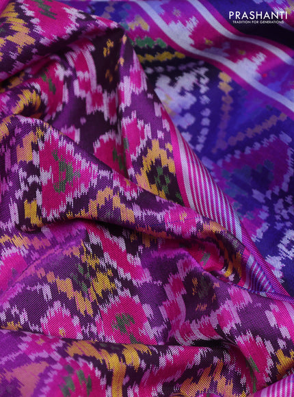 Rajkot patola silk saree dark blue and purple with allover ikat weaves and ikat woven border