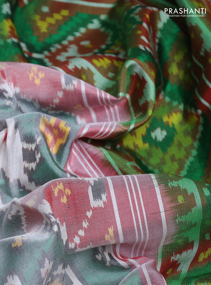 Rajkot patola silk saree green and dual shade of maroon with allover ikat weaves and ikat woven border