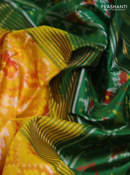 Rajkot patola silk saree mustard yellow and green with allover ikat weaves and ikat woven zari border