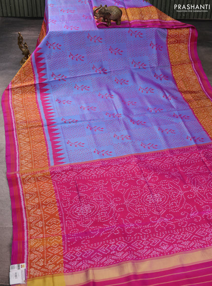 Rajkot patola silk saree dual shade of bluish purple and magenta pink with allover ikat weaves and ikat woven zari border