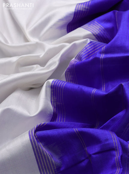 Pochampally silk saree off white and royal blue with plain body and ikat rettapet zari woven border