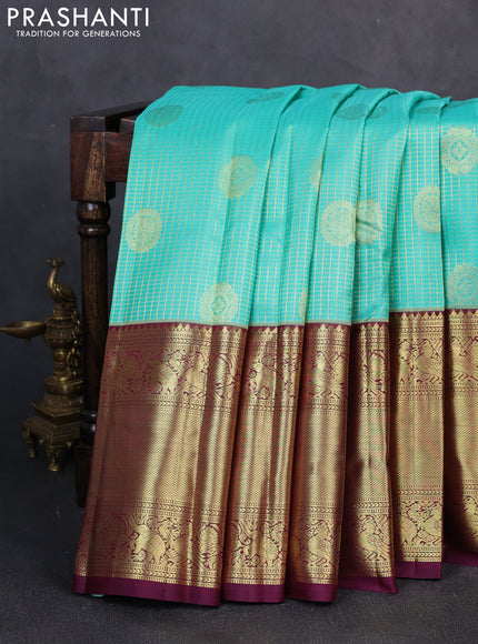 Pure kanchipuram silk saree teal green and wine shade with allover small zari checks & buttas and long zari woven border