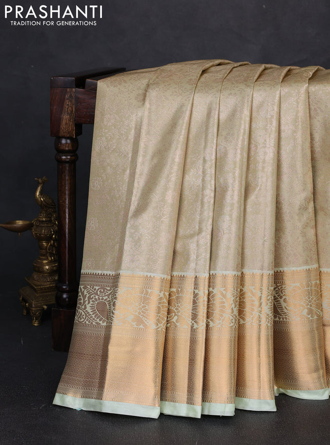 Bangalori tissue silk saree teal green with allover zari woven brocade weaves and long zari woven border