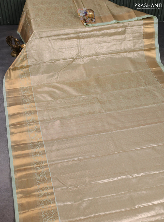 Bangalori tissue silk saree teal green with allover zari woven brocade weaves and long zari woven border