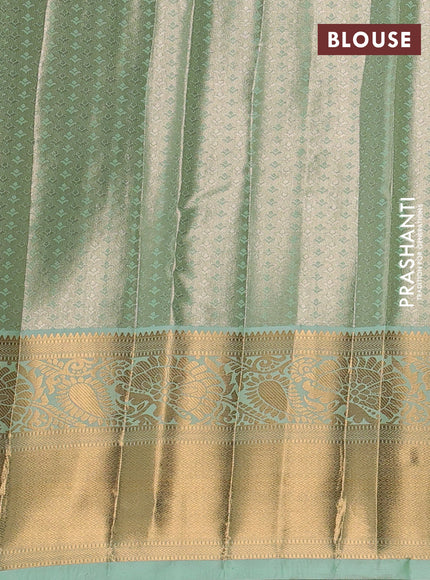 Bangalori tissue silk saree teal green with allover zari woven brocade weaves and long zari woven border