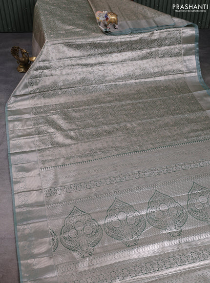 Bangalori tissue silk saree pastel green with allover zari woven brocade weaves and long zari woven border