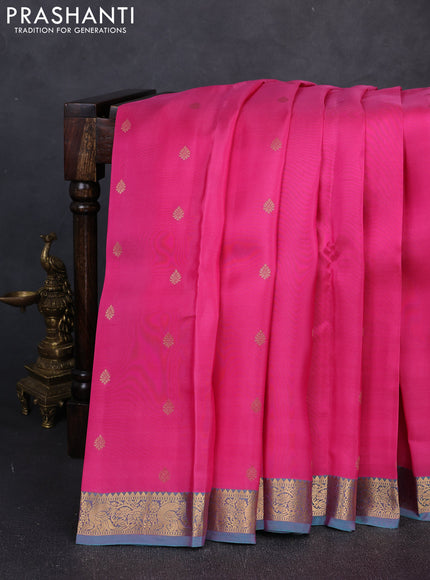 Kanchipuram silk saree pink and dual shade of teal green with allover zari woven buttas and zari woven border