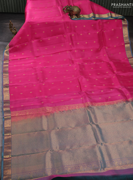 Kanchipuram silk saree pink and dual shade of teal green with allover zari woven buttas and zari woven border