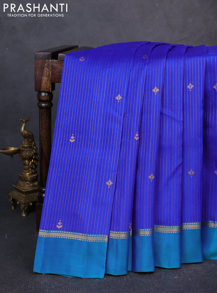 Kanchipuram silk saree royal blue and peacock green with allover zari woven stripes & buttas and zari woven simple border