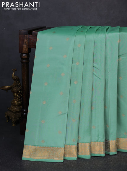 Kanchipuram silk saree teal shade and dark pink with allover zari woven buttas and zari woven border