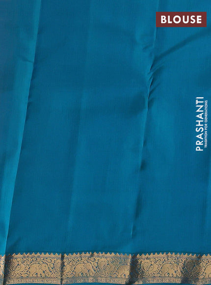 Kanchipuram silk saree dual shade of pinkish orange and teal green with allover zari woven buttas and zari woven border