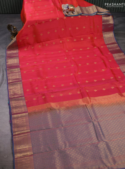 Kanchipuram silk saree dual shade of pinkish orange and dual shade of teal green with allover zari woven buttas and long zari woven border
