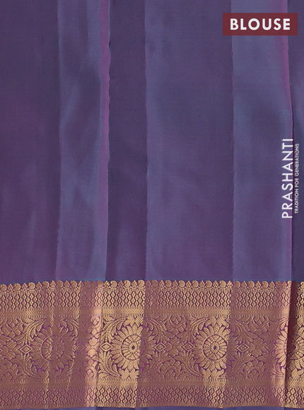 Kanchipuram silk saree dual shade of pinkish orange and dual shade of teal green with allover zari woven buttas and long zari woven border