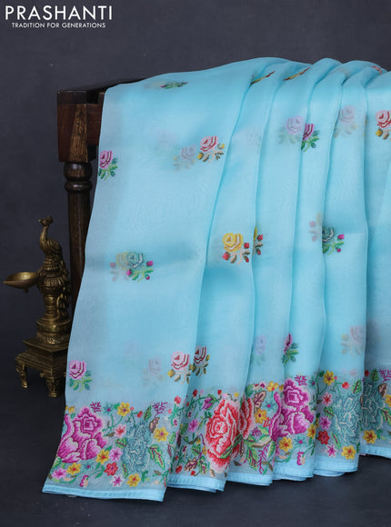 Pure organza silk saree light blue with embroidery work buttas and floral design embroidery border