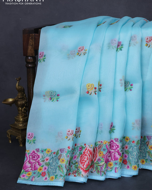 Pure organza silk saree light blue with embroidery work buttas and floral design embroidery border