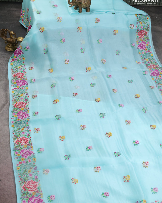 Pure organza silk saree light blue with embroidery work buttas and floral design embroidery border
