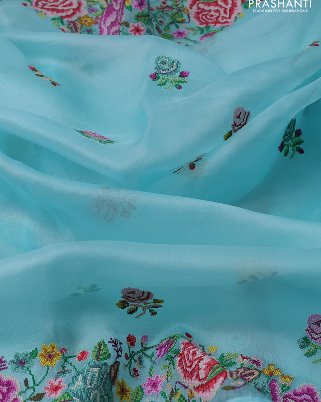 Pure organza silk saree light blue with embroidery work buttas and floral design embroidery border