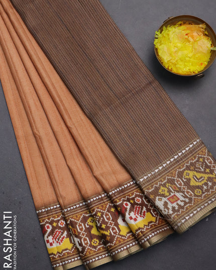 Semi tussar saree peach orange and brown with plain body and patola printed border