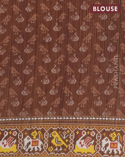 Semi tussar saree peach orange and brown with plain body and patola printed border