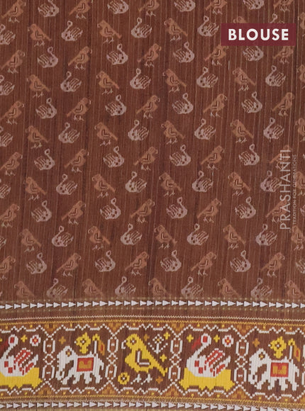 Semi tussar saree peach orange and brown with plain body and patola printed border