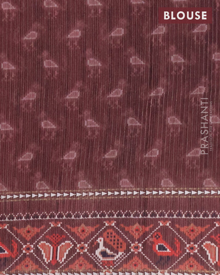 Semi tussar saree dark peach and brown with plain body and patola printed border
