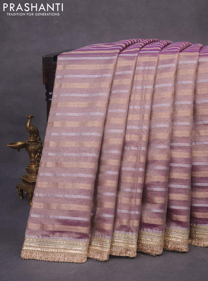Tissue saree dual shade of violet with allover silver & gold zari weaves and lace work border