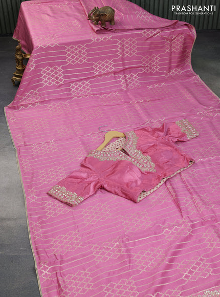 Munga tussar saree mauve pink with allover zari weaves and lace work blue