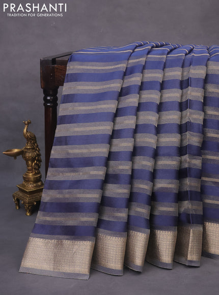 Organza saree blue with allover zari weaves and zari woven border