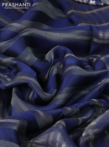 Organza saree blue with allover zari weaves and zari woven border