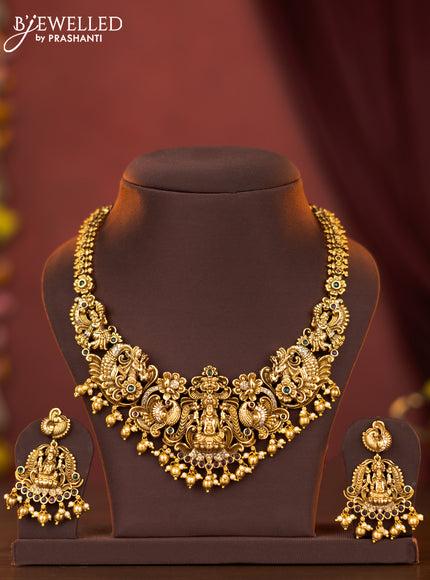 Antique necklace lakshmi design with kemp & cz stones and pearl & golden beads hangings