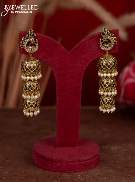 Antique triple layer jhumkas with kemp & cz stones and pearl hangings