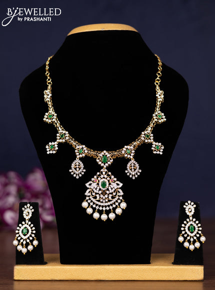 Zircon necklace with emerald & cz stones and pearl hangings in gold finish