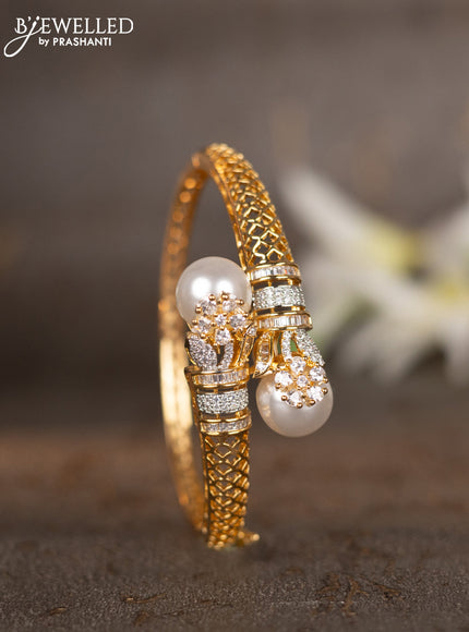 Bracelets with cz stones and pearls in gold finish