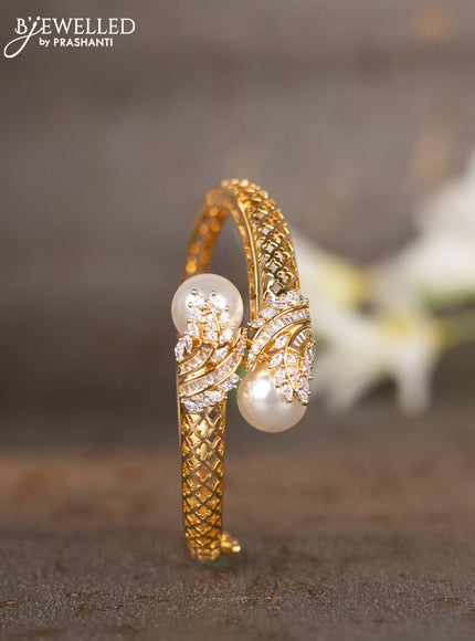 Bracelets with cz stones and pearls in gold finish