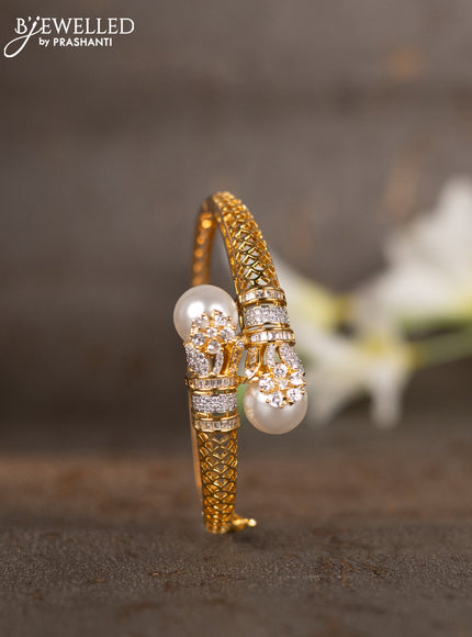 Bracelets with cz stones and pearls in gold finish