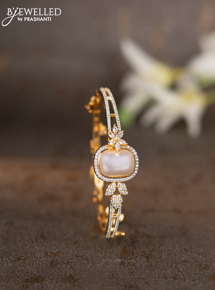 Bracelets with cz stones and pearls & hangings in gold finish