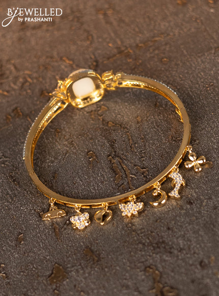 Bracelets with cz stones and pearls & hangings in gold finish
