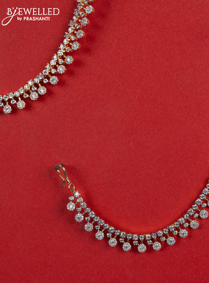 Zircon maatal with cz stones in gold finish