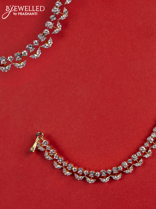 Zircon maatal with cz stones in gold finish
