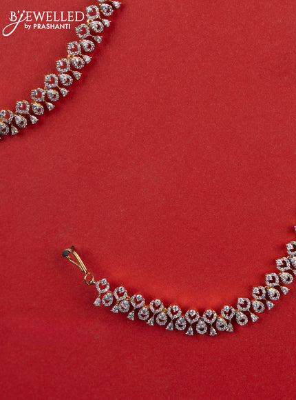 Zircon maatal with cz stones in gold finish