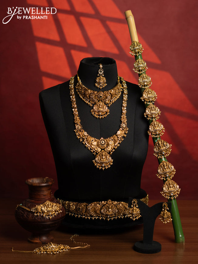 Antique bridal set lakshmi design with kemp & cz stones and pearl & golden beads hangings