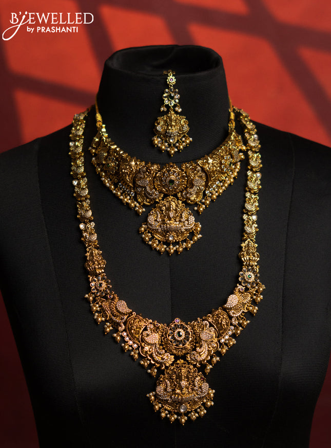 Antique bridal set lakshmi design with kemp & cz stones and pearl & golden beads hangings