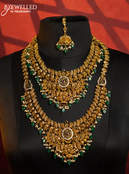 Antique combo set peacock design with kemp & cz stones and pearl & green beads hangings